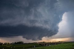 A massive, rapidly rotating wall cloud and ominous severe supercell thunderstorm dominate the sky over the plains near Braman, Oklahoma, on April 23, 2026. This intense atmospheric structure and mesocyclone preceded a dangerous rain-wrapped tornado. Extreme weather photography and storm chasing by Mauro Greco.