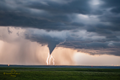 Rare nocturnal tornado illuminated by lightning south of Emporia, Kansas - May 31, 2026
