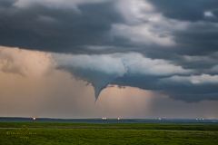 Rare nocturnal tornado illuminated by lightning south of Emporia, Kansas - May 31, 2026